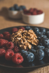 Red fruits with cereals and nuts