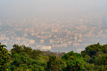 A blurred cityscape of Chiang Mai city as a result of burning season which caused serious air pollution.
