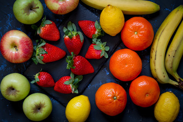 Varied fruits with dark background