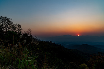 The view of sunset on the top of the mountain.