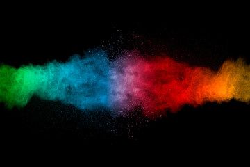 Explosion of multicolored dust on black background. - 250080763