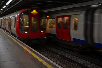 Obraz premium Motion blurred moving train at station.