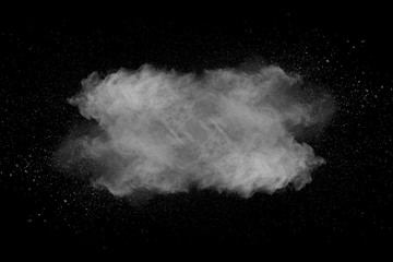 Explosion of white dust on black background.