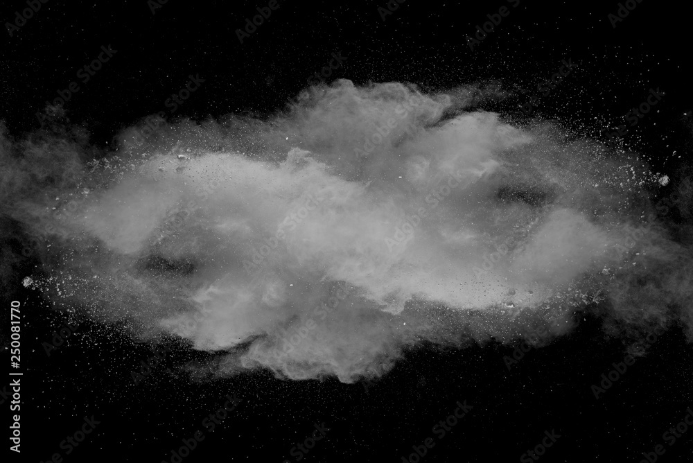 Wall mural explosion of white dust on black background.