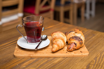 Cup of tea and croissants