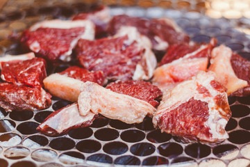 Raw meat on the barbecue. Meat with fat. Barbecue of Brazil