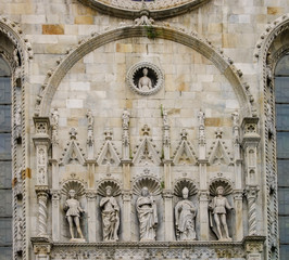 A detail view of the beautiful statues and ornaments of Duomo di Como, Italy