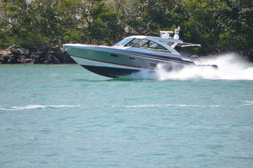 Fototapeta premium High-end cabin cruiser speeding on Government Cut ,Miami,Florida