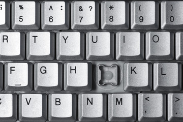 Broken button on a computer keyboard, close-up