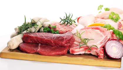raw meat. Different types of raw pork meat, chicken and beef with spices and herbs