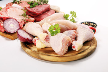 raw meat. Different types of raw pork meat, chicken and beef with spices and herbs