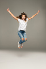 Happy jumping young girl