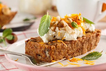carrot fruit cake with nuts and cream