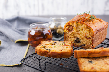 Traditional Italian bread with dried tomatoes and olives. Homemade cakes for lunch and breakfast and ingredients. Free space for text. Copy space.