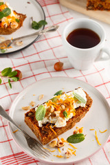 carrot fruit cake with nuts and cream