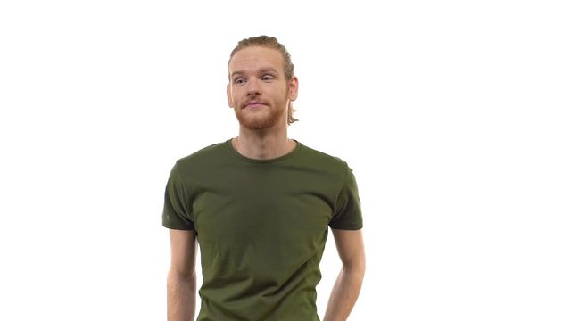 Slowmo cute redhead hipster young guy shrugging smirking uncertain, having doubts, standing clueless, puzzled answer unsure what say, unimpressed, unbothered careless, white background