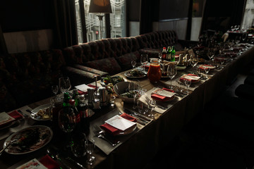 Luxury catering at restaurant wedding reception, special occasion table arrangement in brown, rustic colors, food, glasses and tableware served