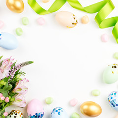 Naklejka na ściany i meble Festive Happy Easter background with decorated eggs, flowers, candy and ribbons in pastel colors on white. Copy space