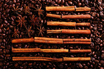 Coffee beans, star anise and cinnamon in the shape of the American flag. Fragrant spices for coffee drink, close-up, concept americano.