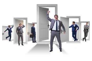 Businessman in uncertainty concept with many doors