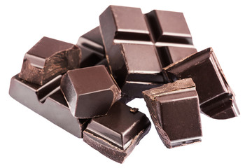 Chopped chocolate cubes, pieces of dark chocolate isolated on white background