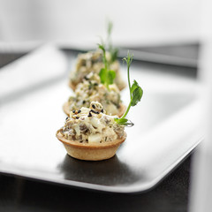Appetizer with chicken and cheese in baskets. Concept of food, restaurant, catering, menu.