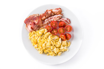 Breakfast with scrambled eggs, bacon and tomatoes isolated on white background. Top view
