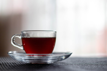 A cup of coffee. A transparent cup of coffee.