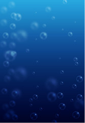 Blue water background with blurred realistic bubbles or drops.