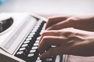 finger hold on button in vintage typewriter