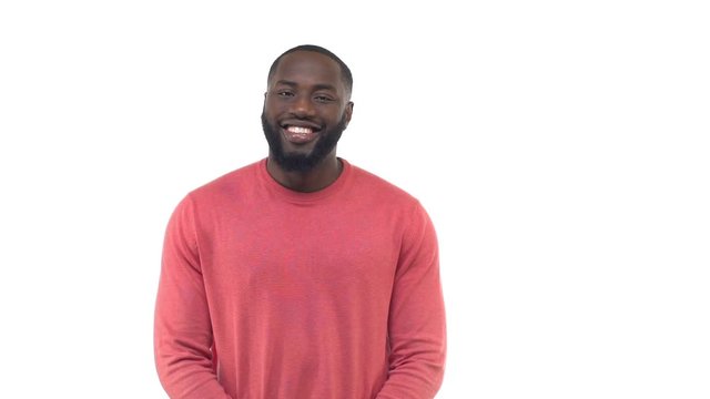 Slow motion handsome charismatic bearded african-american man changing emotions starting happy smiling positive giving kind gaze, raising eyebrow sassy, frowning puzzled, frustrated white background