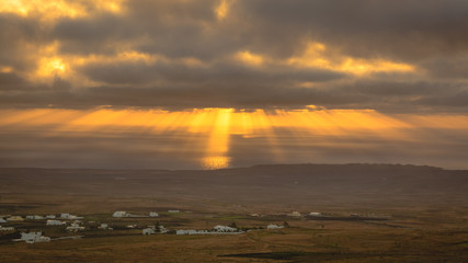 Sunbeams during sunrise from the mountain Guanapay in Teguise, Lanzarote