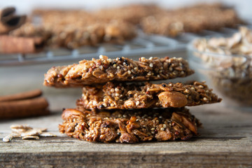 Homemade cookie with oat flakes, nuts and quinoa. Wholegrain cookies. healthy snack or dessert.