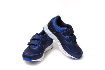 Pair of sports shoes, blue sneakers isolated on white background. Top view.