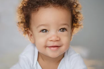 Fototapeten Cute baby with fluffy hair. Pretty boy. © Miramiska