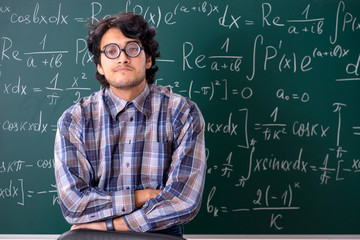 Funny male math teacher in the classroom 
