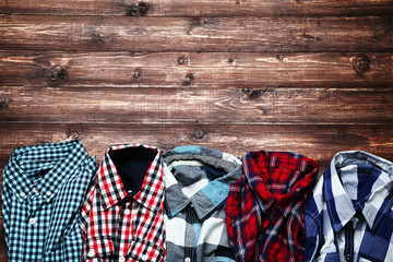 Colorful shirts on brown wooden table