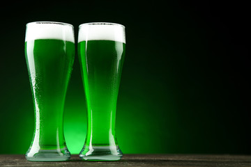 St. Patrick's Day. Glasses of green beer on dark background