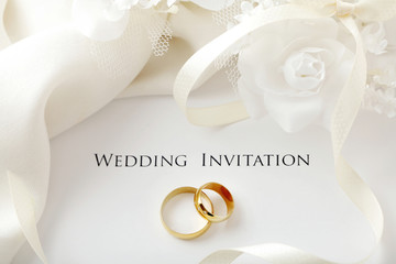 wedding rings and wedding invitation