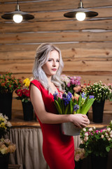 Girl with a bouquet of flowers in their hands.