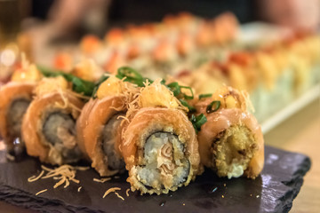 Photo of sushi rolls - japanese food in restaurant - close-up image