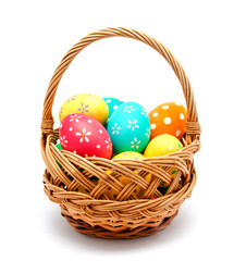Perfect colorful handmade easter eggs in the basket isolated