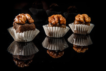 closeup three healthy useful organic handmade candies with walnut