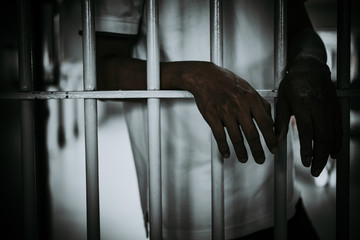 Hands of men desperate to catch the iron prison,prisoner concept,thailand people,Hope to be free.