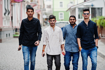 Obraz premium Group of four indian ethnicity friendship togetherness mans.