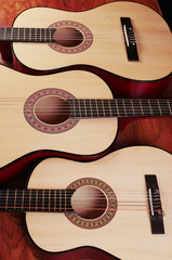 Three acoustic guitars.