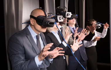 Frightened business people in vr glasses