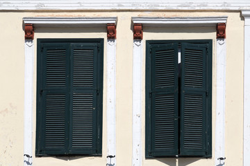 Windows with green wooden shutters