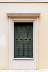 Windows with green wooden shutters