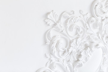 Beautiful ornate white decorative plaster moldings in studio